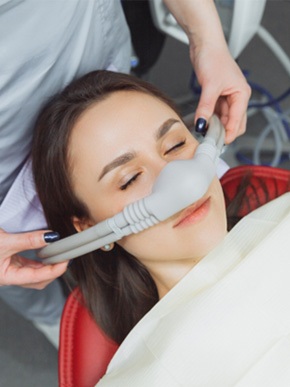 Woman relaxing while receiving nitrous oxide dental sedation in Manchester, NH
