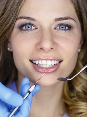 Woman receiving dental exam