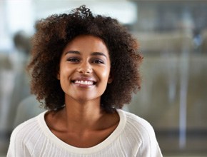 woman smiling about the cost of cosmetic dentistry in Manchester 