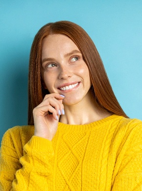 woman smiling and thinking about dental bonding in Manchester