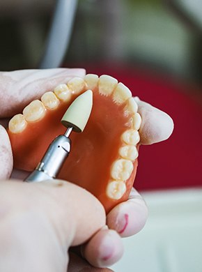A technician making a denture
