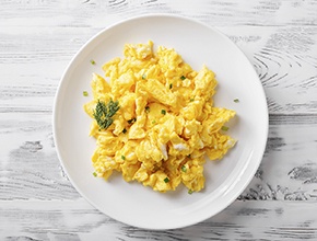 Scrambled eggs on a white plate