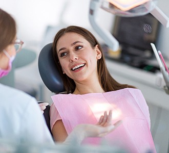 A woman talking with her dentist