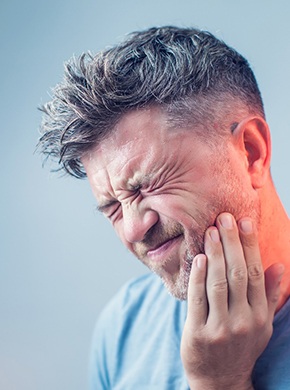 A man suffering from dental implant failure