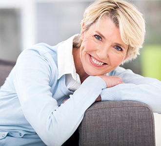 woman smiling with dental implants in Manchester