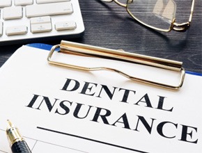 closeup of dental insurance form on table 