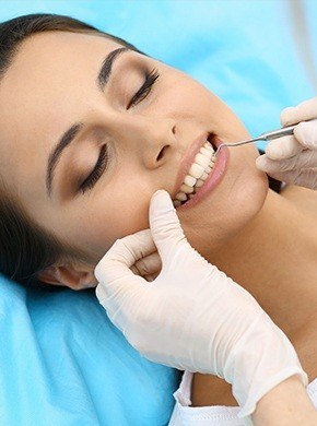 Female patient receiving periodontal maintenance