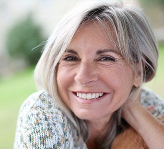 Older woman outdoors smiling