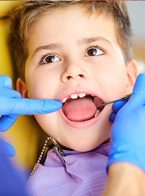 Child receiving dental checkup
