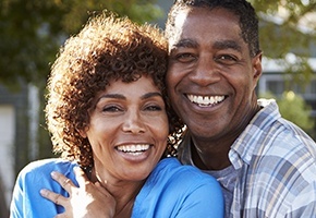 Smiling older mand and woman outdoors