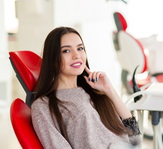 Woman visiting her cosmetic dentist in Manchester