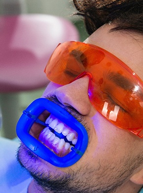young man in dentist chair ready for professional teeth whitening