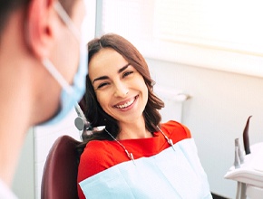 Happy patient at appointment for equilibration for TMD