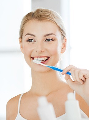 Woman brushing teeth