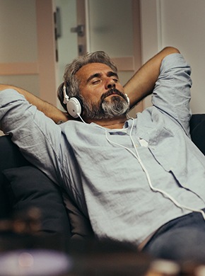 Patient at home resting comfortably after wisdom tooth removal in Manchester