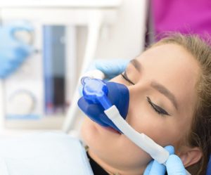 Woman benefiting from laughing gas at the dentist