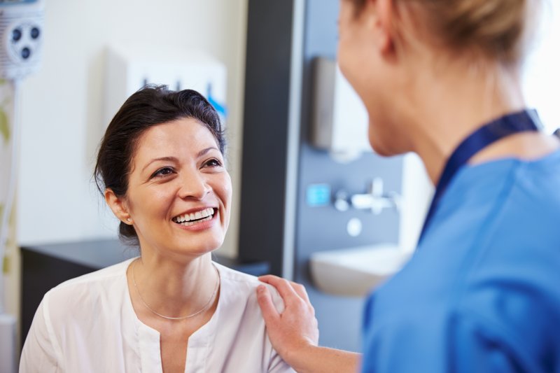 Dentures patient smiling at dental checkup